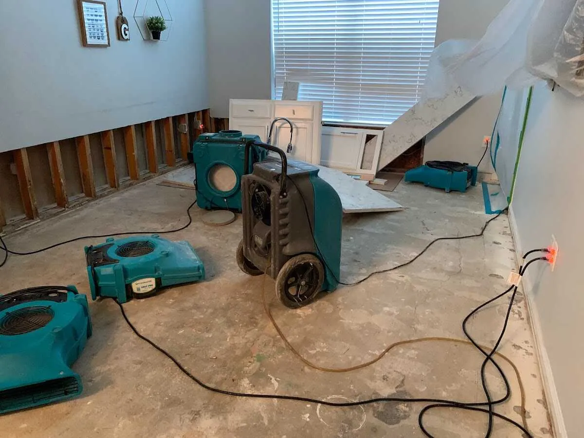 Dehumidifier in flood-cut room for Water Damage Restoration in Davidson